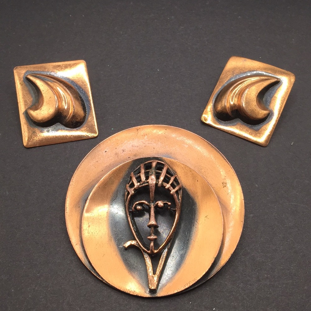 Vintage copper face brooch